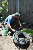 Anthony Castelo did a lot of the work with the irrigation tubing during the workshop. Image courtesy of WMG.